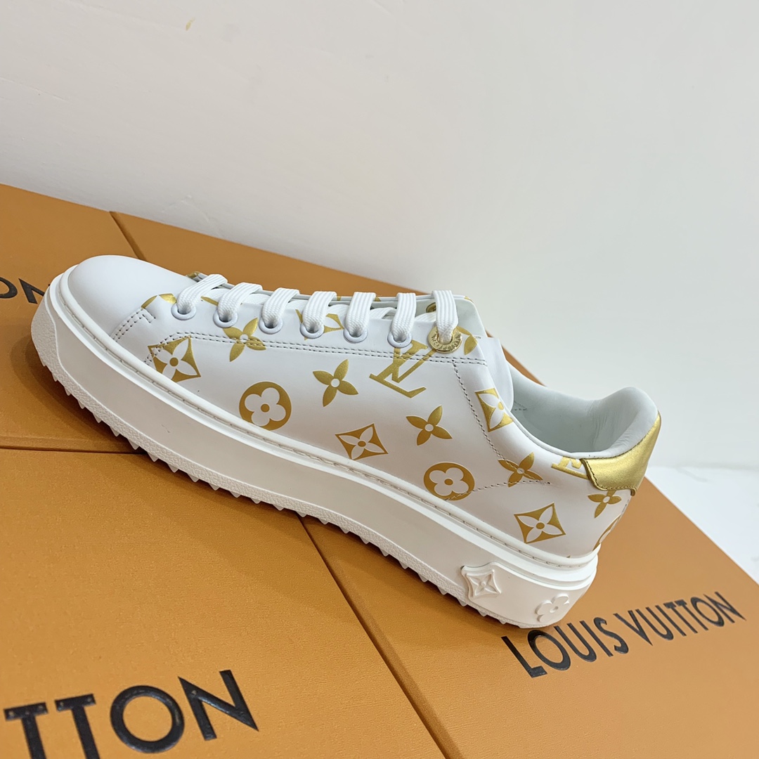 l**is V*t*n low-top sneakers