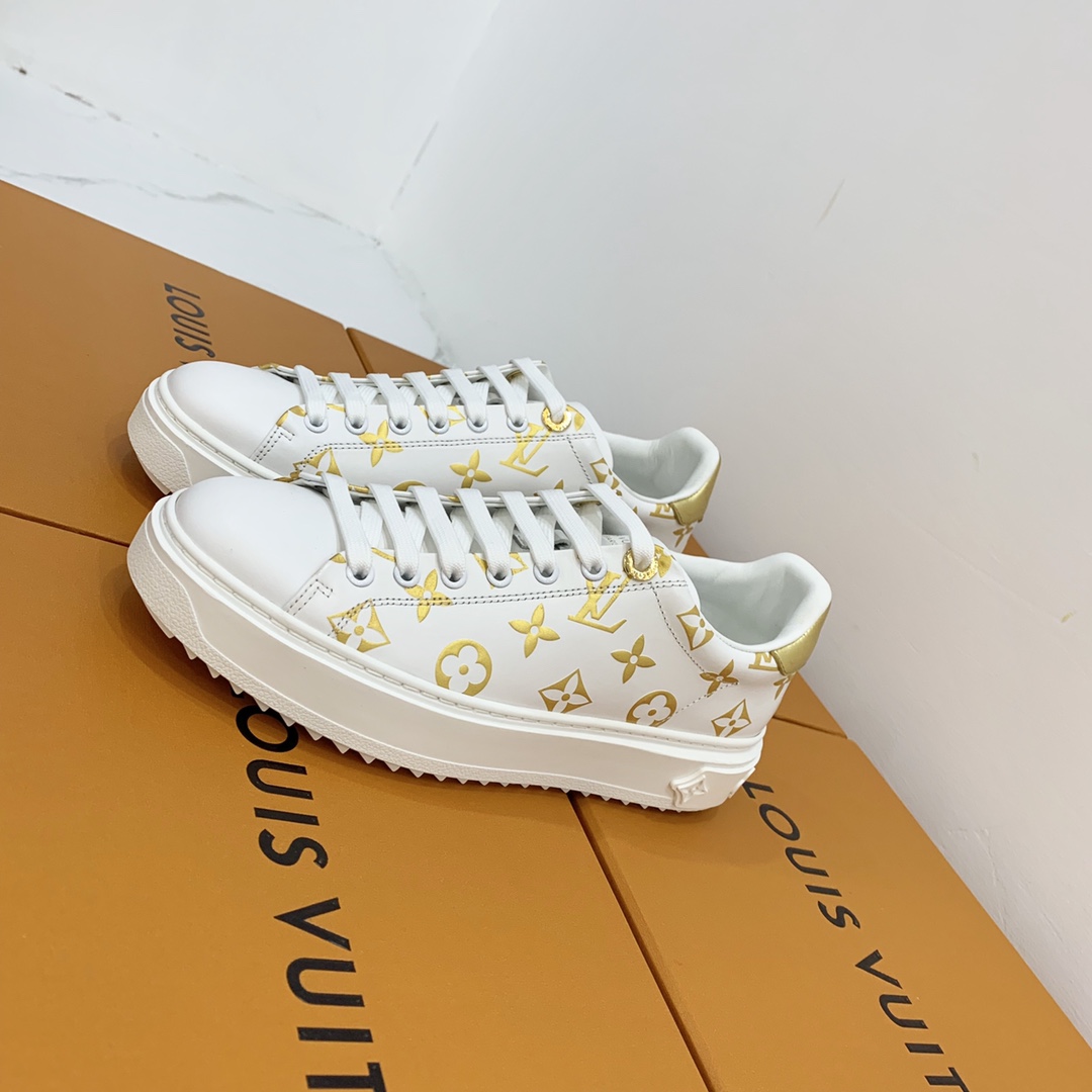 l**is V*t*n low-top sneakers