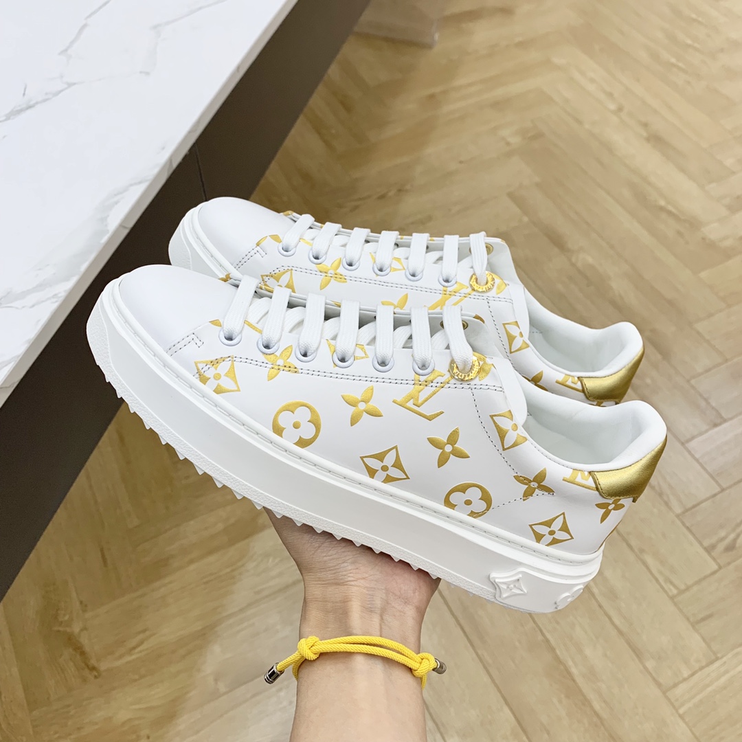 l**is V*t*n low-top sneakers