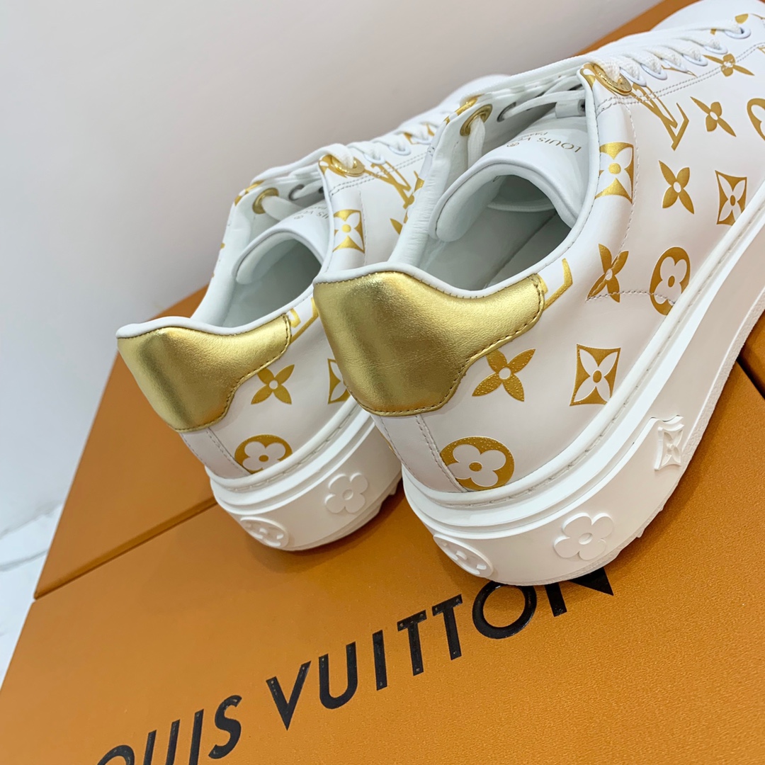 l**is V*t*n low-top sneakers